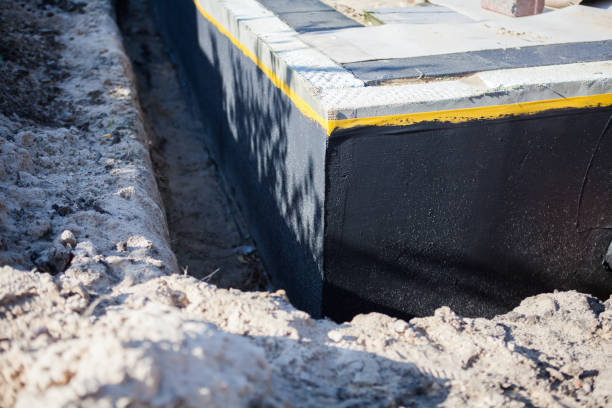 Professional Waterproofing technician working in Walled Lake, MI